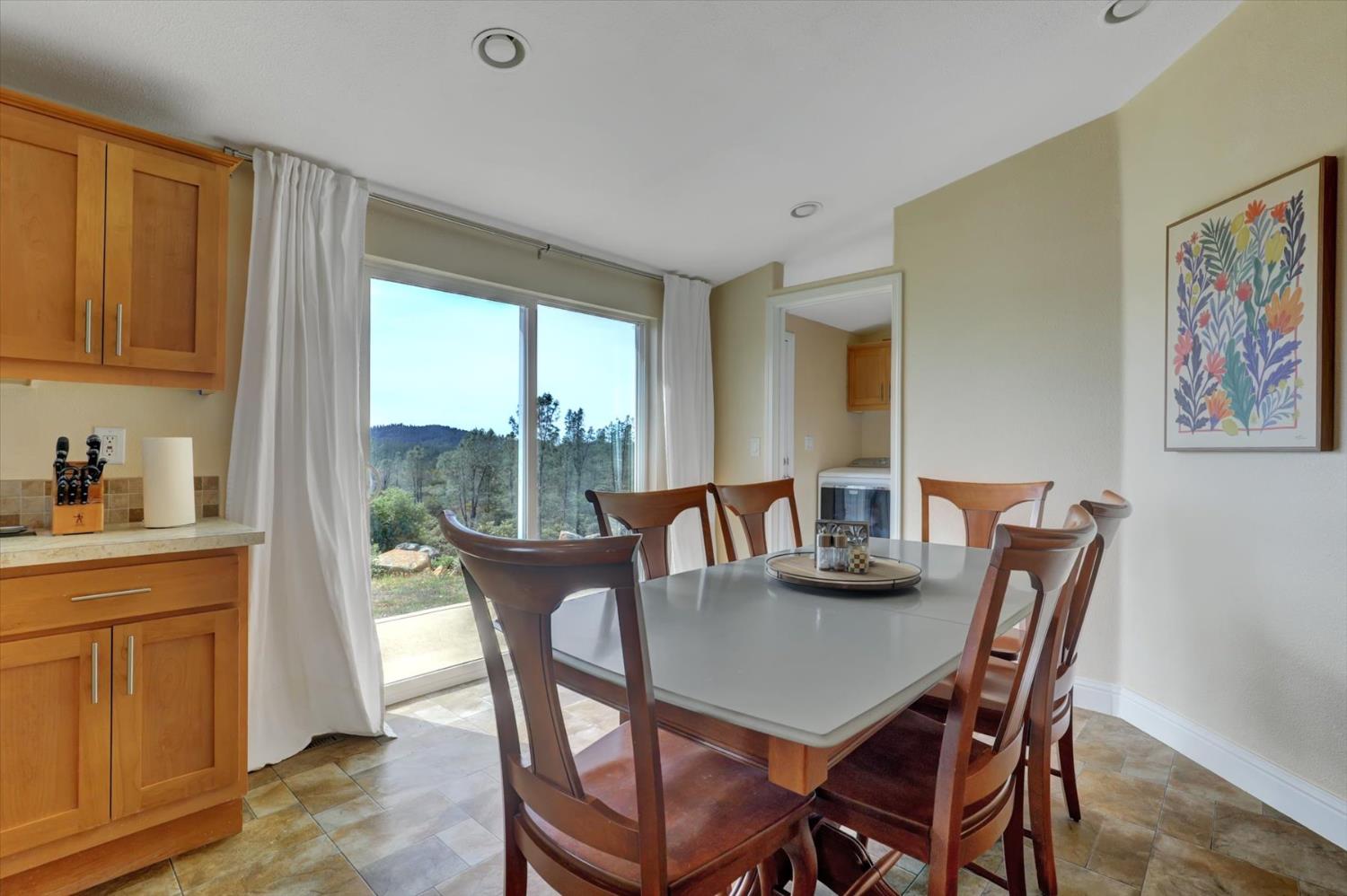 13886 Meadow Valley Road Dobbins, CA 95935 - Photo 17 of 99 a view of a dining room with furniture window and outside view