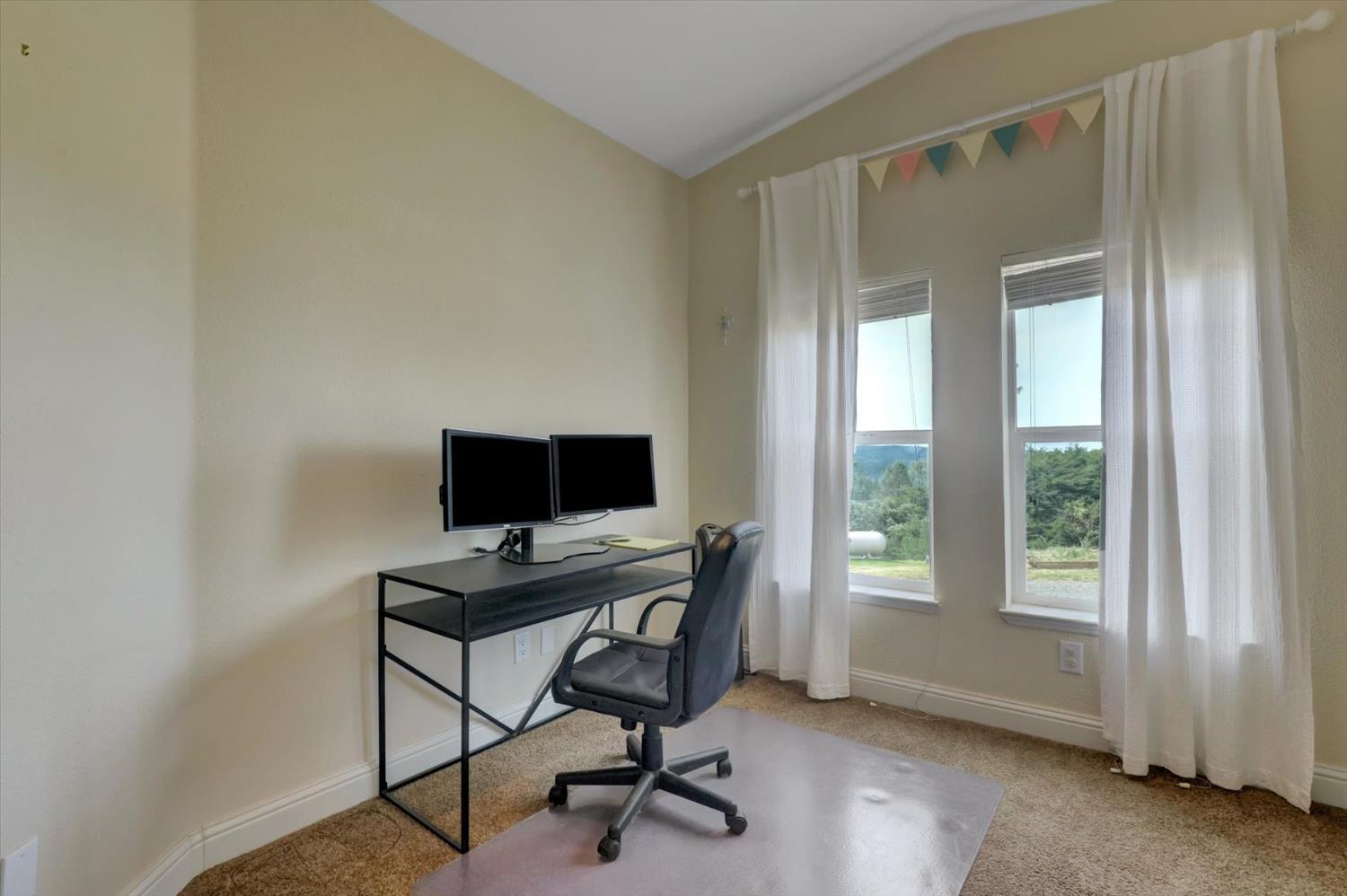 13886 Meadow Valley Road Dobbins, CA 95935 - Photo 28 of 99 a view of a workspace with furniture and a window