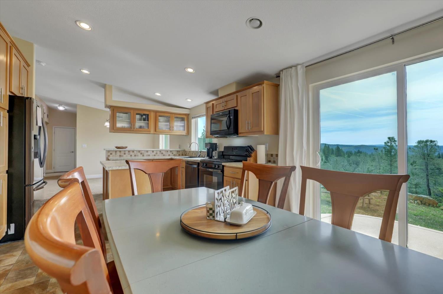 13886 Meadow Valley Road Dobbins, CA 95935 - Photo 29 of 99 a kitchen with a table and chairs