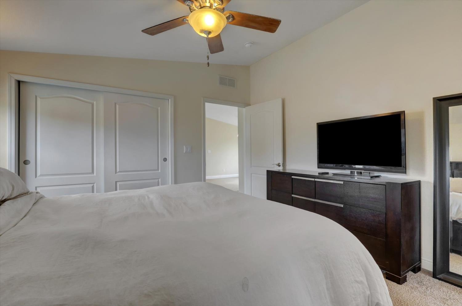 13886 Meadow Valley Road Dobbins, CA 95935 - Photo 30 of 99 a bedroom with a bed and a flat screen tv