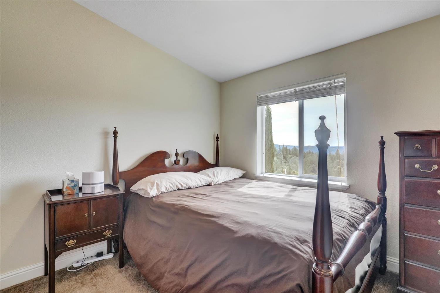 13886 Meadow Valley Road Dobbins, CA 95935 - Photo 34 of 99 a bedroom with a bed and a window