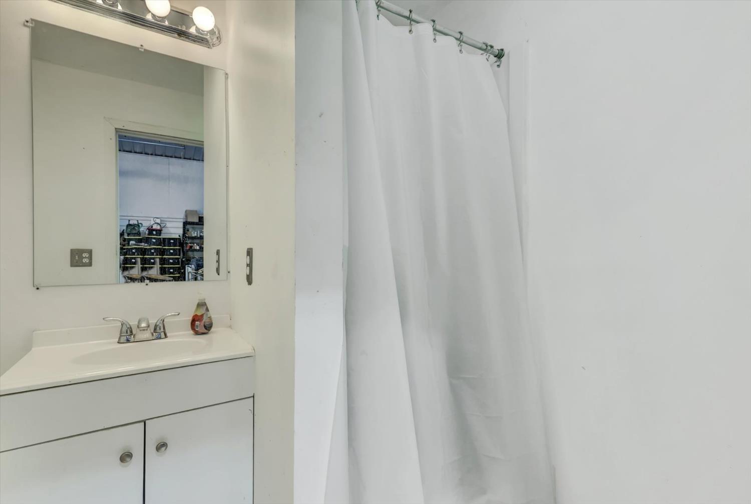 13886 Meadow Valley Road Dobbins, CA 95935 - Photo 40 of 99 a bathroom with a sink and a mirror