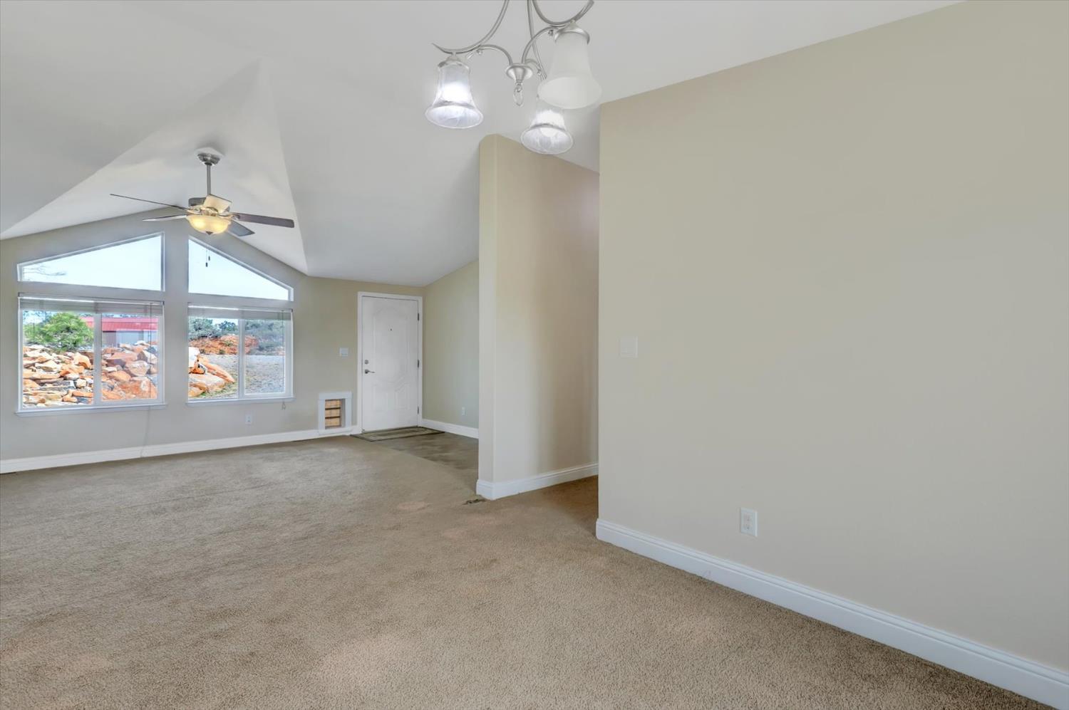 13886 Meadow Valley Road Dobbins, CA 95935 - Photo 8 of 99 en empty room with windows and ceiling fan