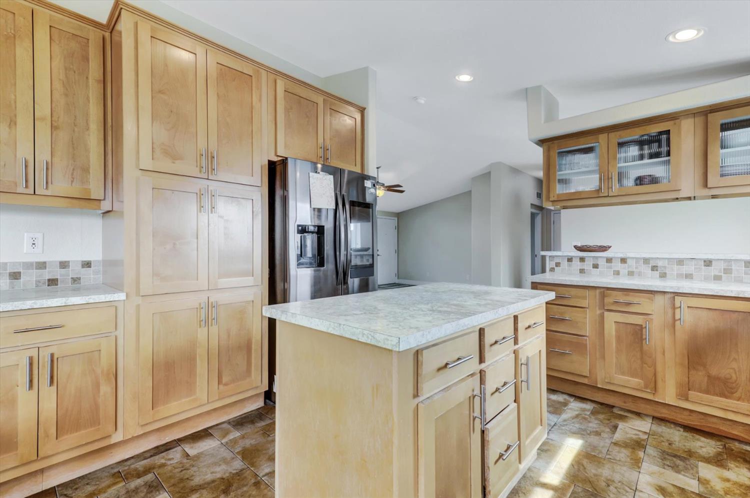 13886 Meadow Valley Road Dobbins, CA 95935 - Photo 10 of 99 a kitchen with granite countertop cabinets and refrigerator