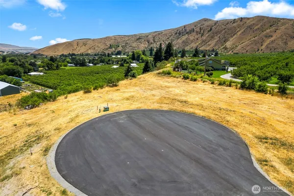 a view of a swimming pool with a yard