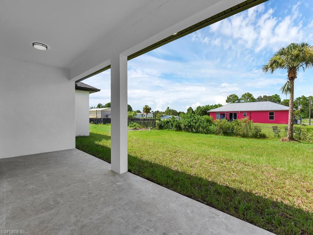 3300 3rd Street Southwest Lehigh Acres, FL 33976 - Photo 21 of 21 View of yard with a patio