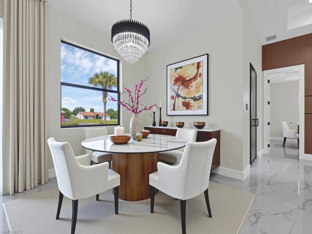 3300 3rd Street Southwest Lehigh Acres, FL 33976 - Photo 10 of 21 Dining room with a chandelier and light marble finish floors