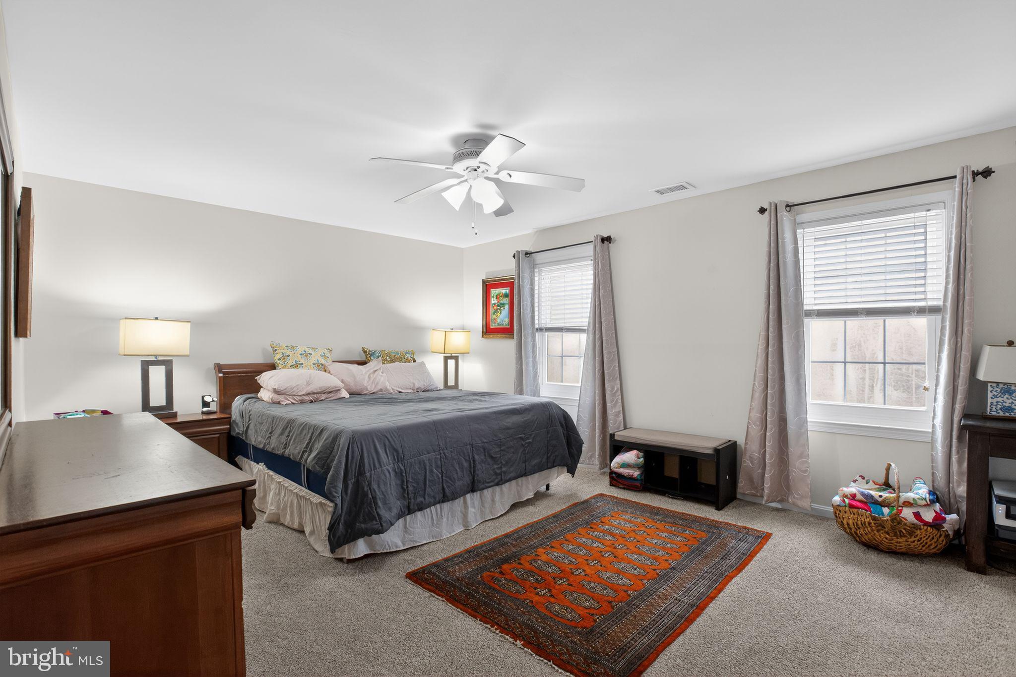 615 Clarks Run Road La Plata, MD 20646 - Photo 14 of 47 a bedroom with a bed and a chandelier