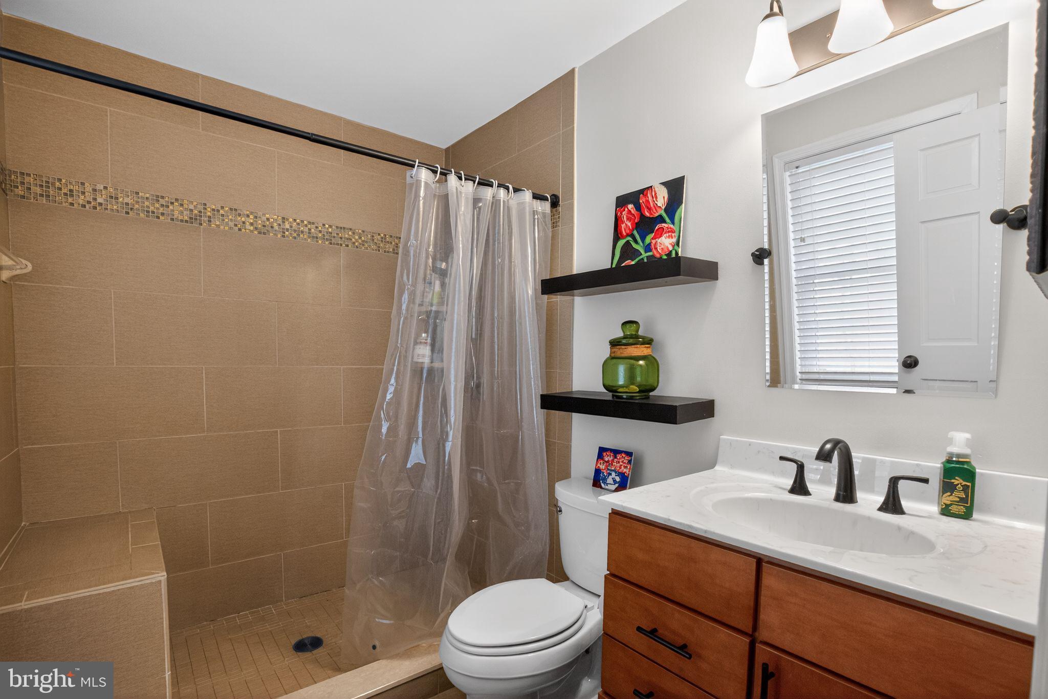615 Clarks Run Road La Plata, MD 20646 - Photo 16 of 47 a bathroom with a sink a toilet and shower
