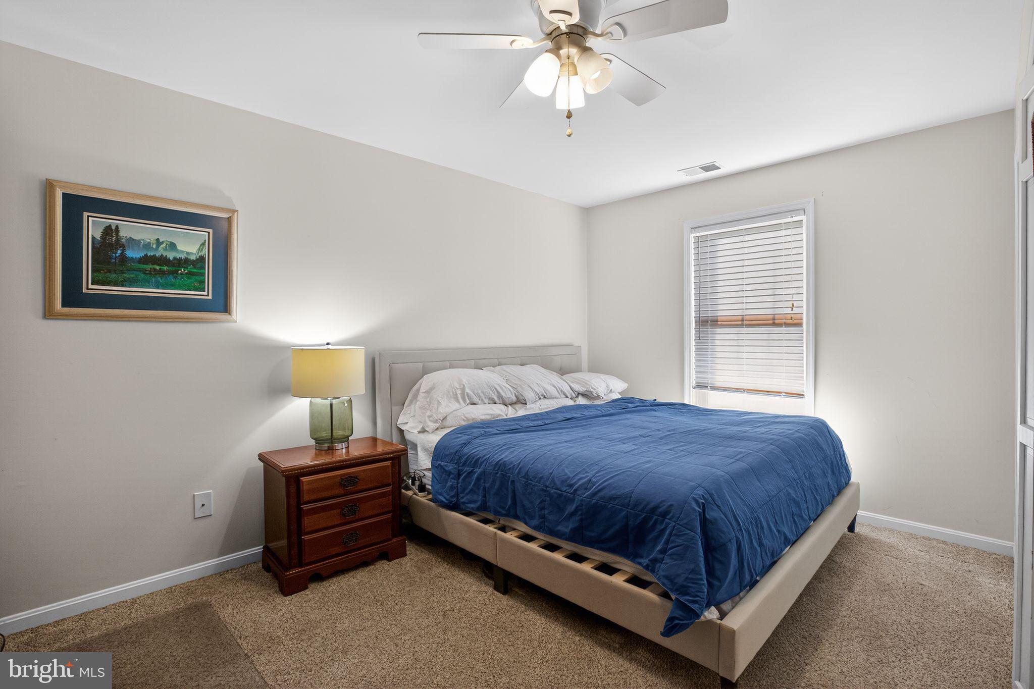 615 Clarks Run Road La Plata, MD 20646 - Photo 17 of 47 a bedroom with a bed and lamp
