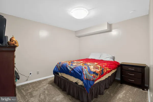 a bed sitting in a room next to a window