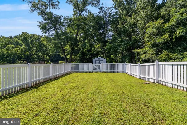 a view of a backyard with swimming pool