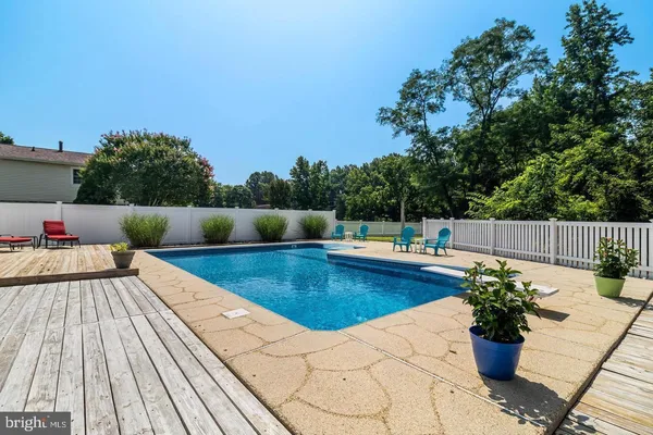 a view of swimming pool with a lounge chair