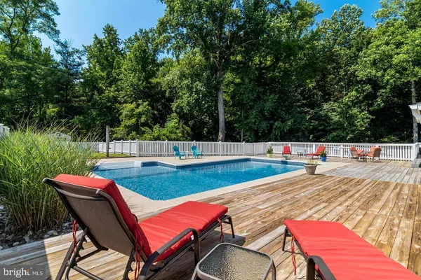 a view of a swimming pool with a patio
