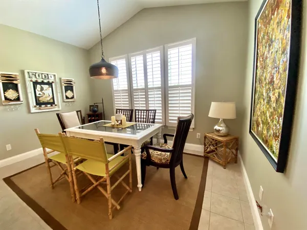 a view of a dining room with furniture window and outside view