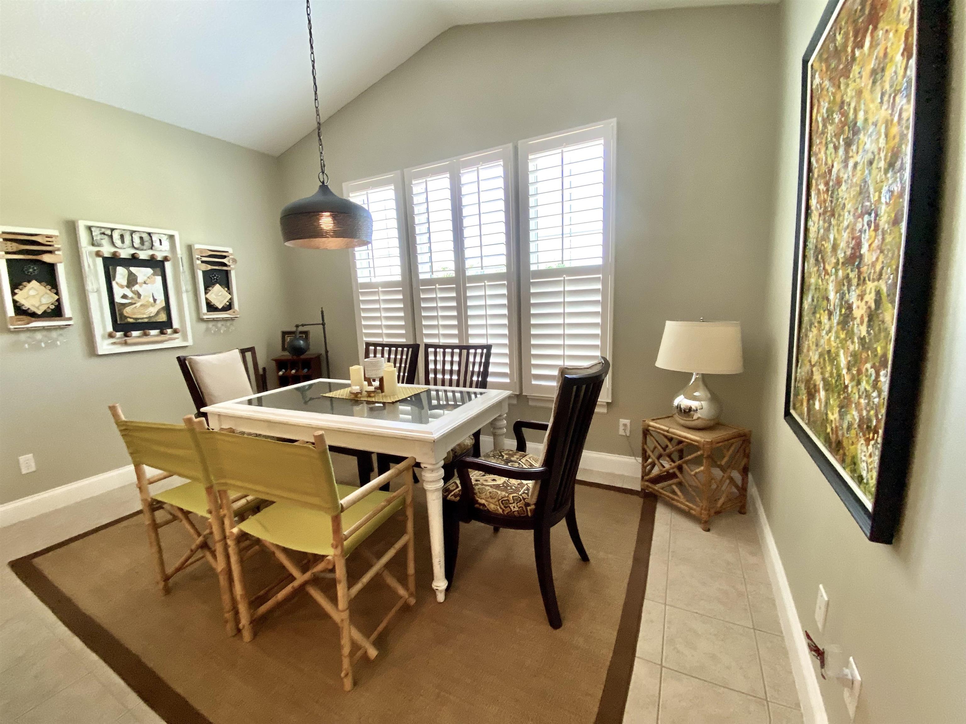 176 Sunset Circle North St. Augustine, FL 32080 - Photo 14 of 44 a view of a dining room with furniture window and outside view