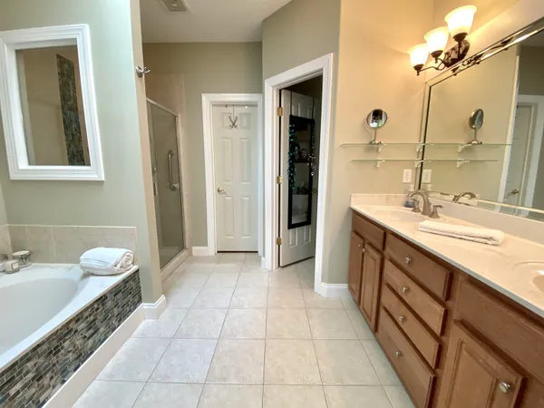 a bathroom with a sink a vanity and a mirror