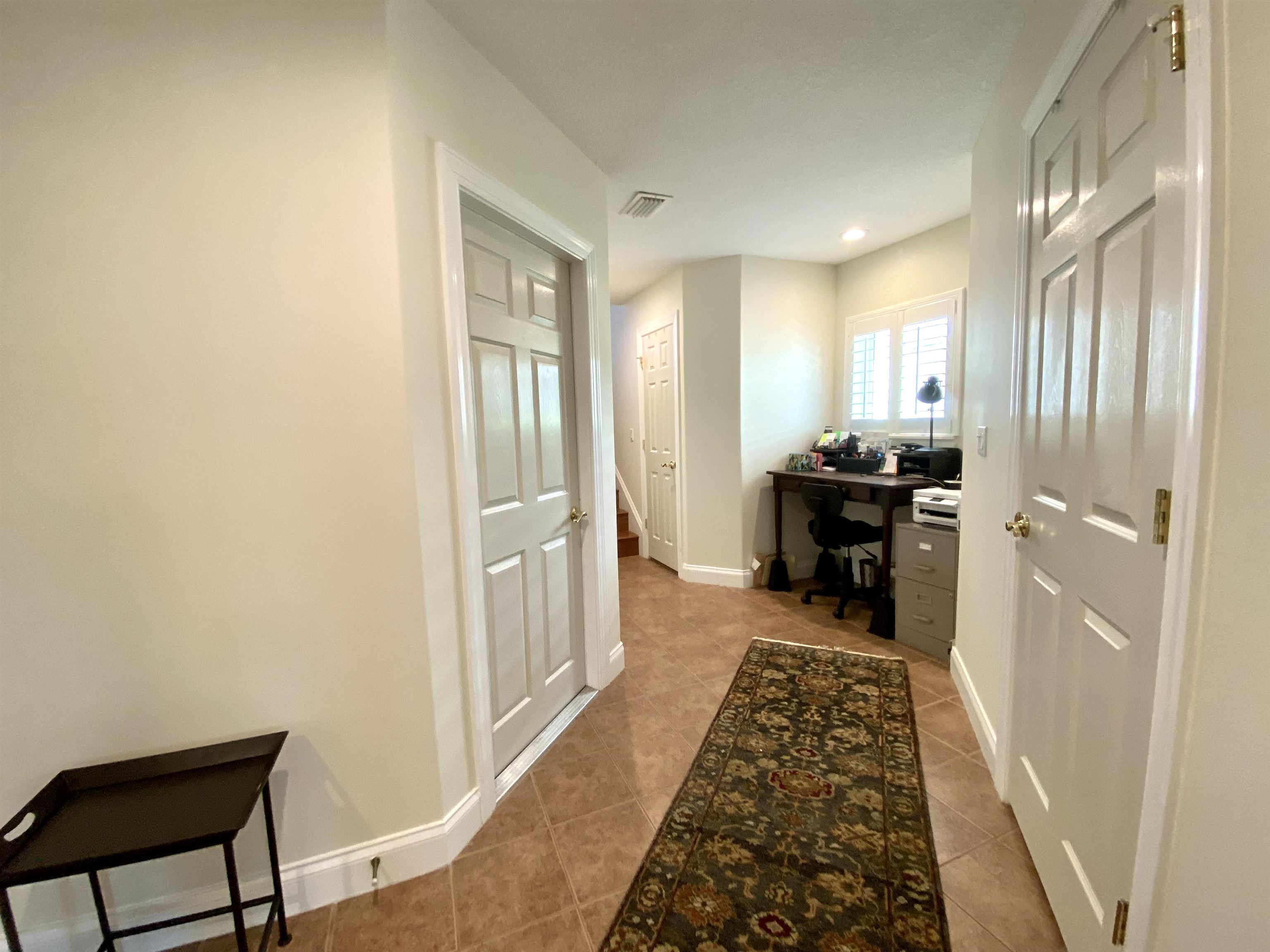 176 Sunset Circle North St. Augustine, FL 32080 - Photo 25 of 44 a view of a hallway to a livingroom with furniture