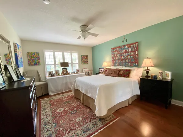 a bed room with a bed window and a television