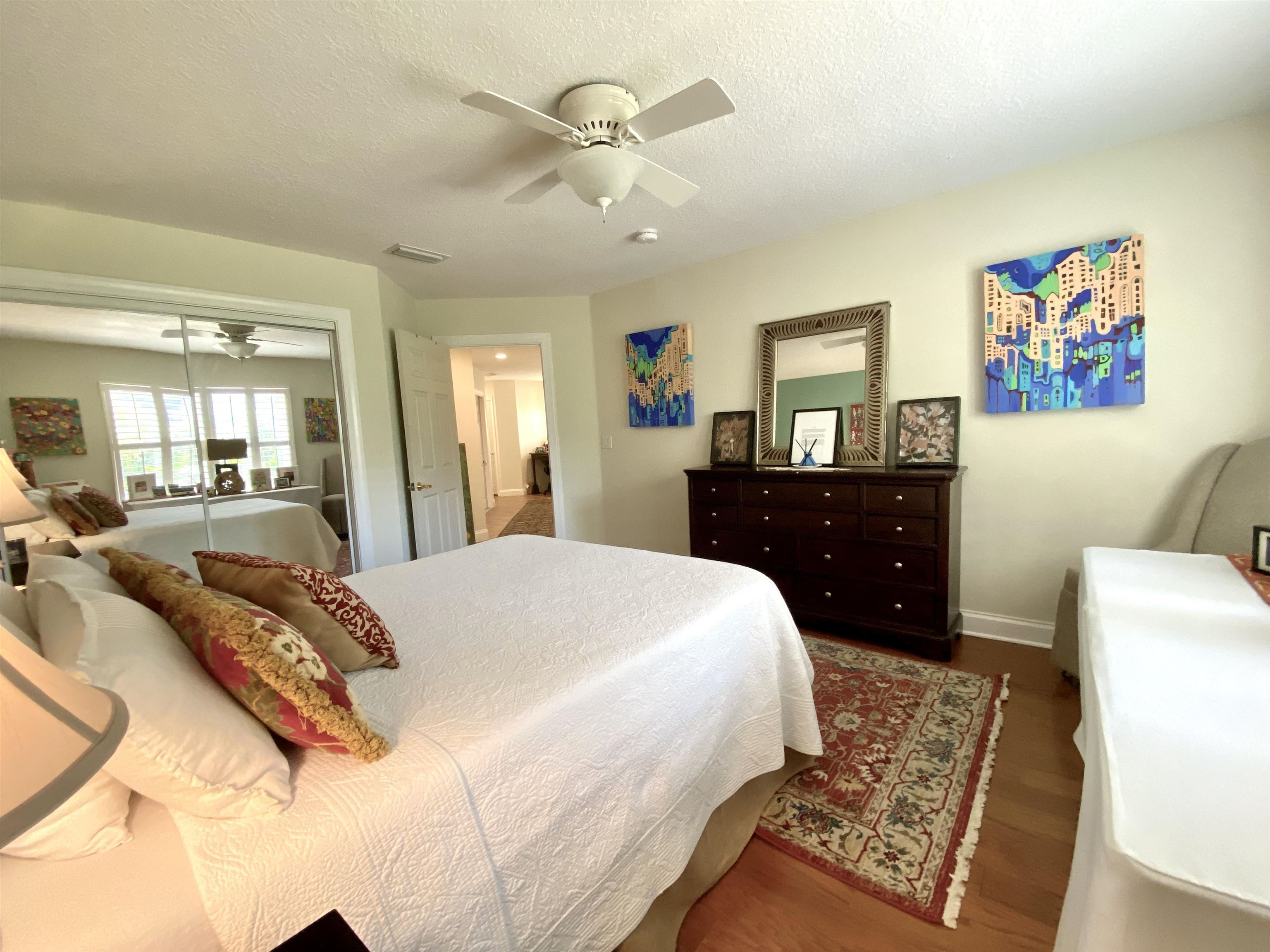 176 Sunset Circle North St. Augustine, FL 32080 - Photo 27 of 44 a spacious bedroom with a bed and a dresser