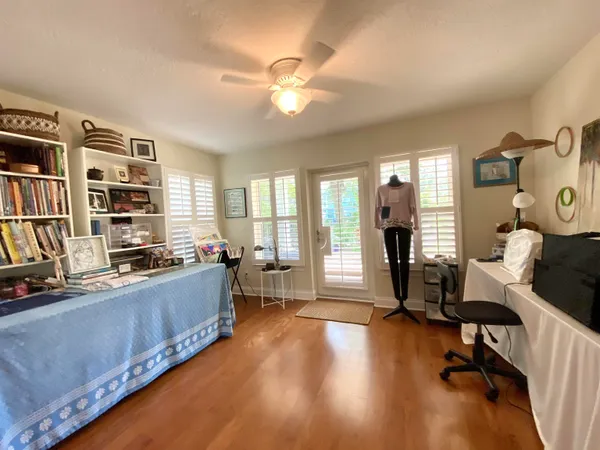 a living room with furniture window and wooden floor