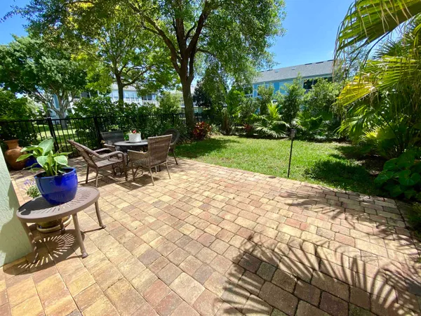 a view of a backyard with sitting area