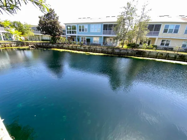 a view of a lake with building in front of it