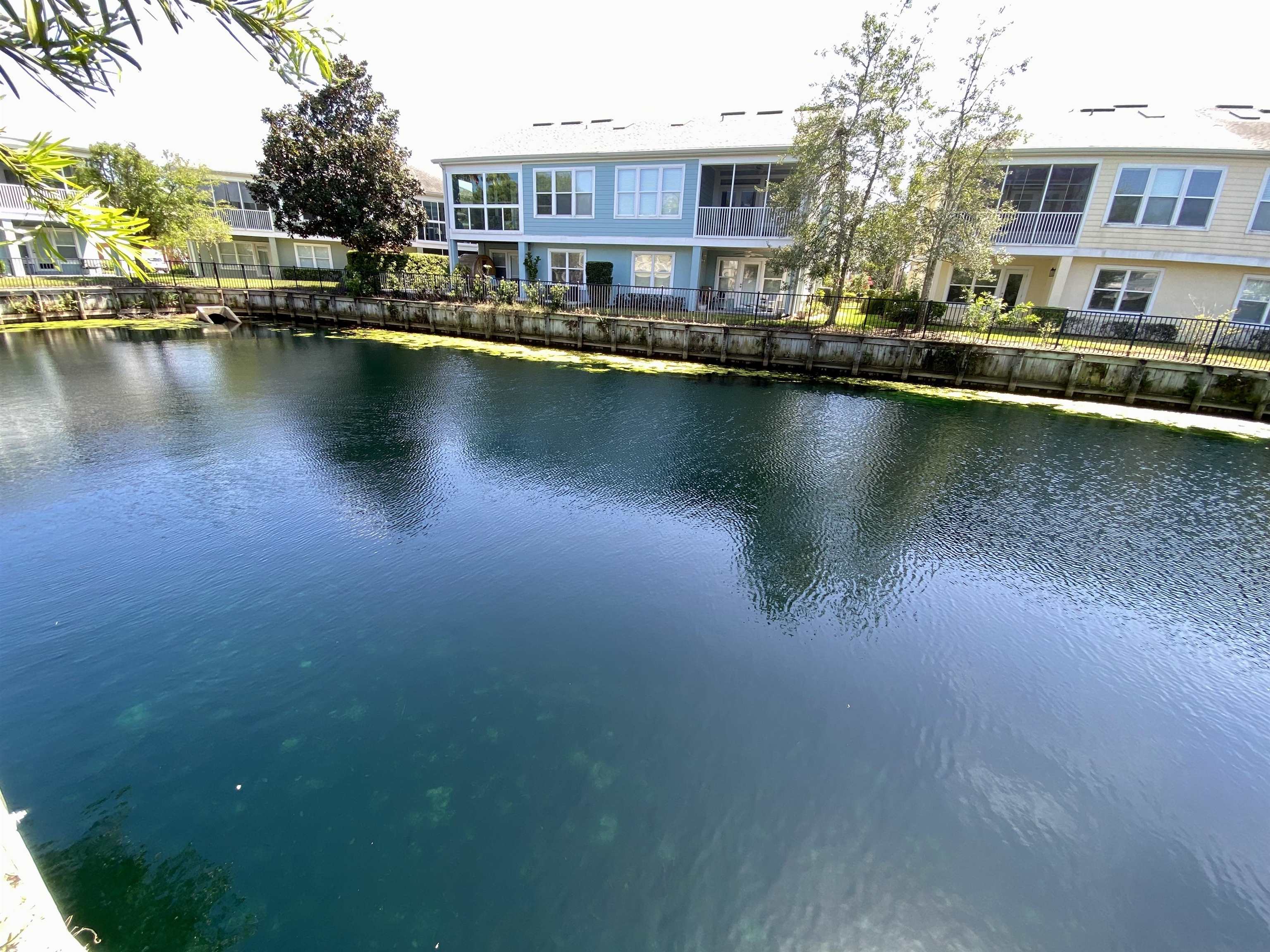 176 Sunset Circle North St. Augustine, FL 32080 - Photo 35 of 44 a view of a lake with building in front of it