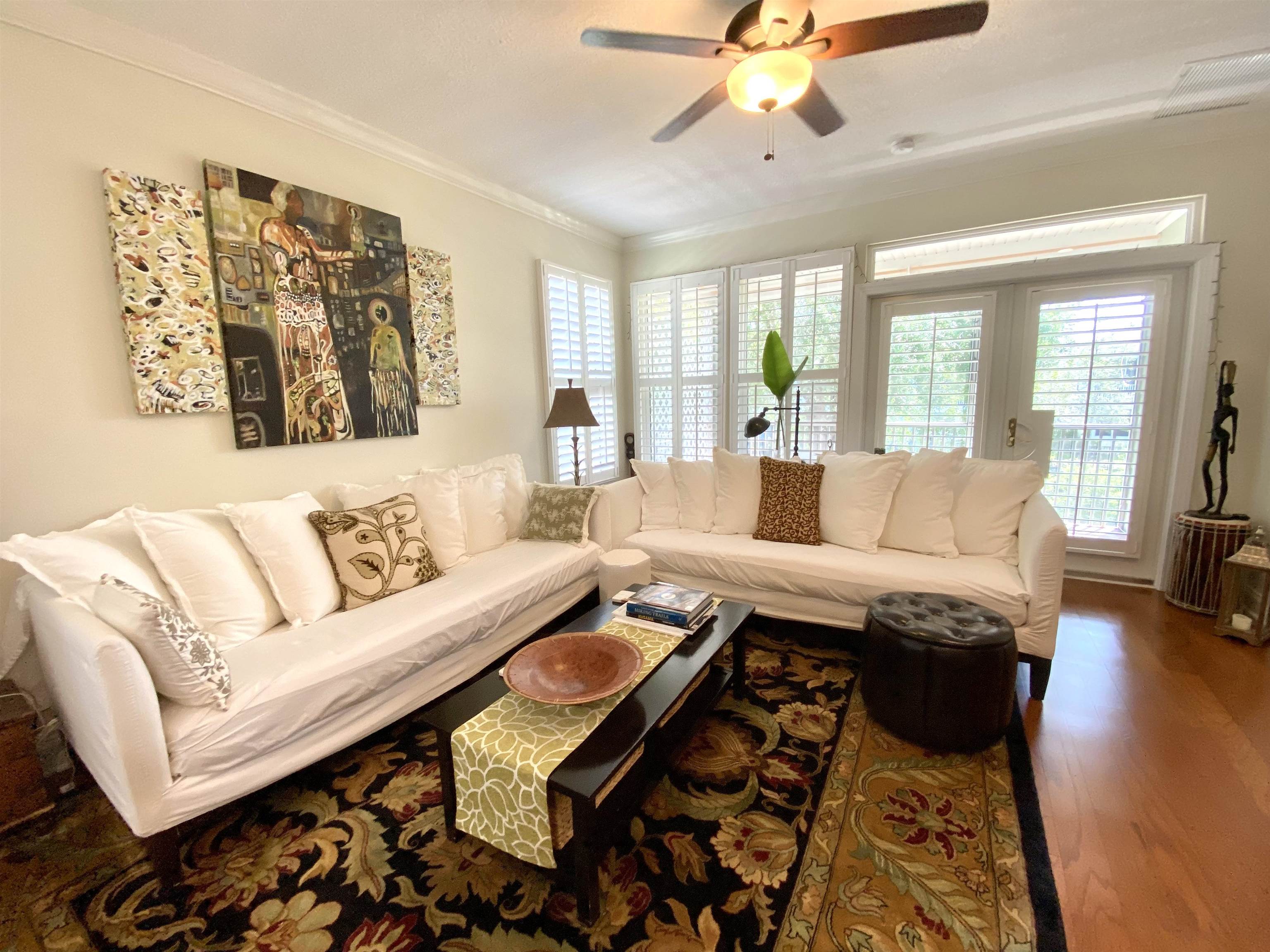 176 Sunset Circle North St. Augustine, FL 32080 - Photo 5 of 44 a living room with fireplace furniture and a large window
