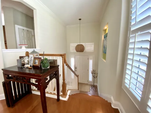 a view of a room with furniture and window
