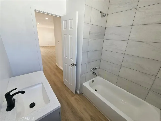 a bathroom with a tub and a shower