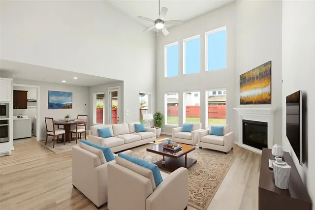 a living room with furniture fireplace and flat screen tv