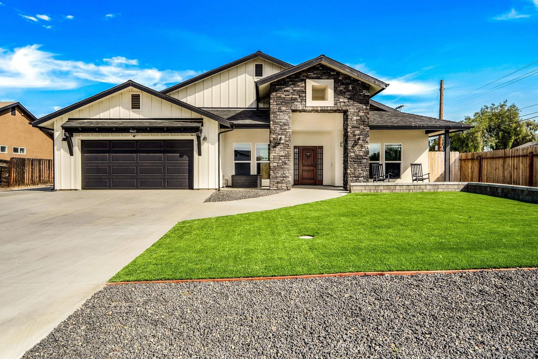 a front view of a house with a yard and porch