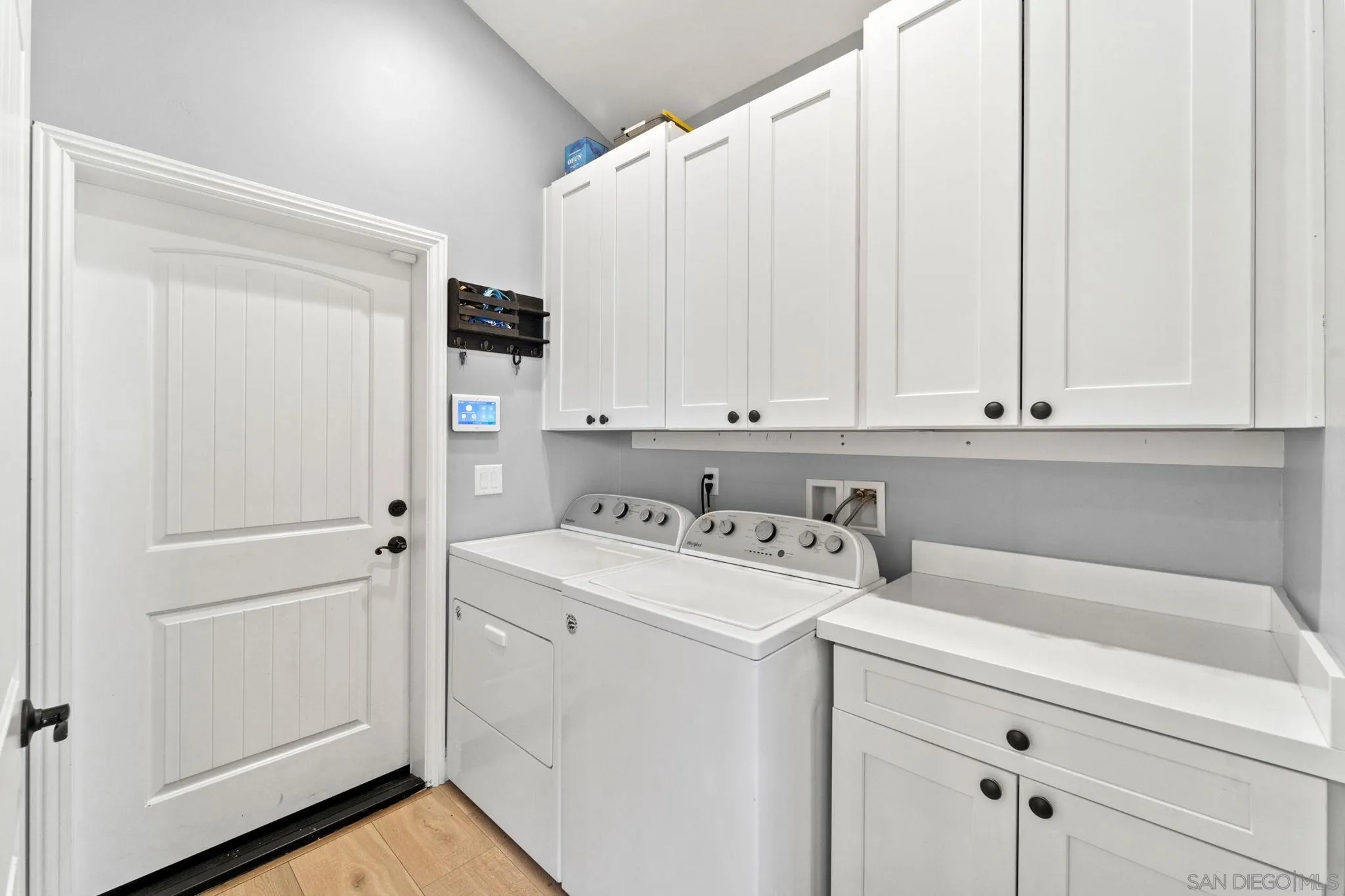 940 Passion Place Ramona, CA 92065 - Photo 12 of 25 a view of a storage and utility room with washer and dryer