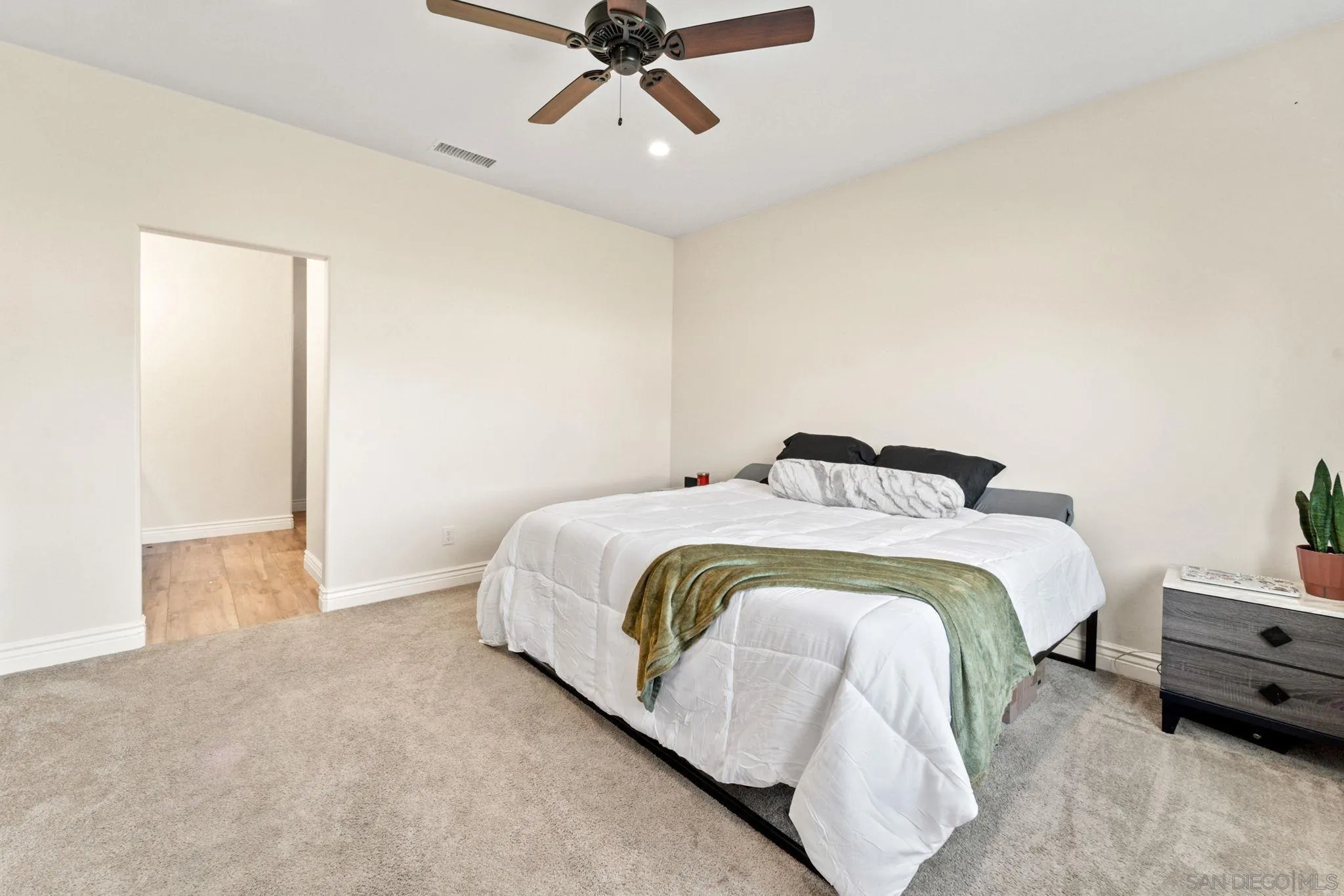 940 Passion Place Ramona, CA 92065 - Photo 14 of 25 a bedroom with a bed and ceiling fan