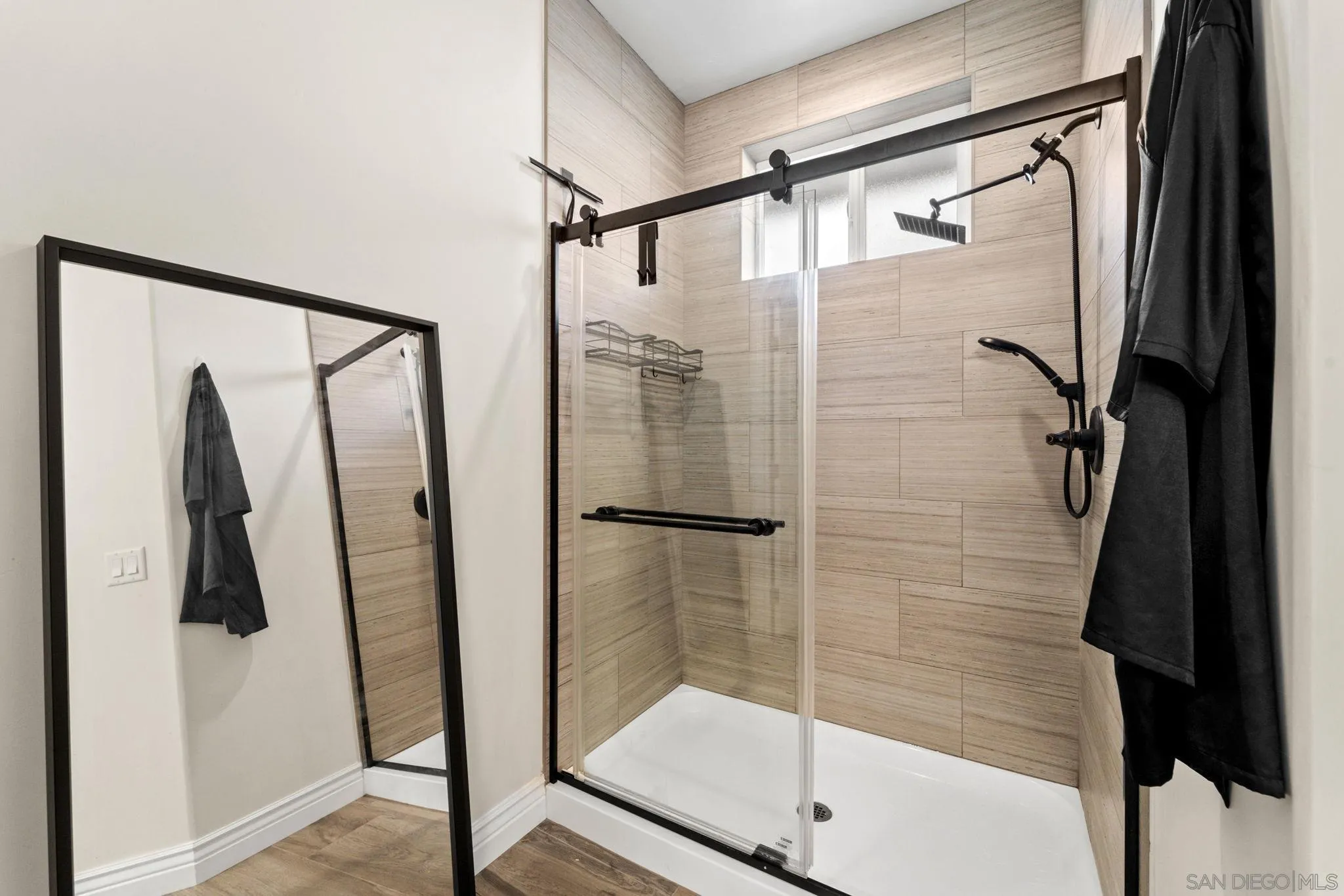 940 Passion Place Ramona, CA 92065 - Photo 16 of 25 a bathroom with a glass shower door