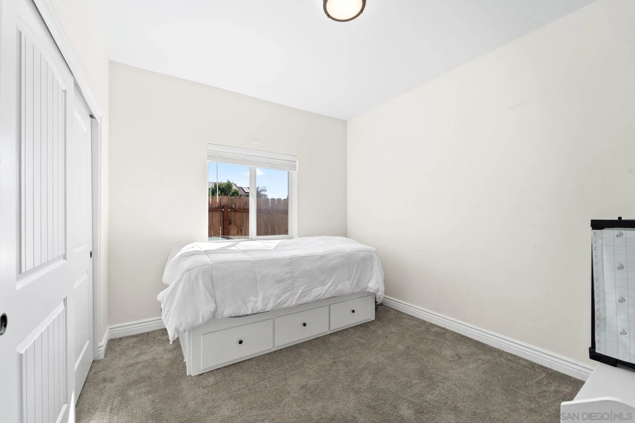 940 Passion Place Ramona, CA 92065 - Photo 20 of 25 a bedroom with a bed and a window