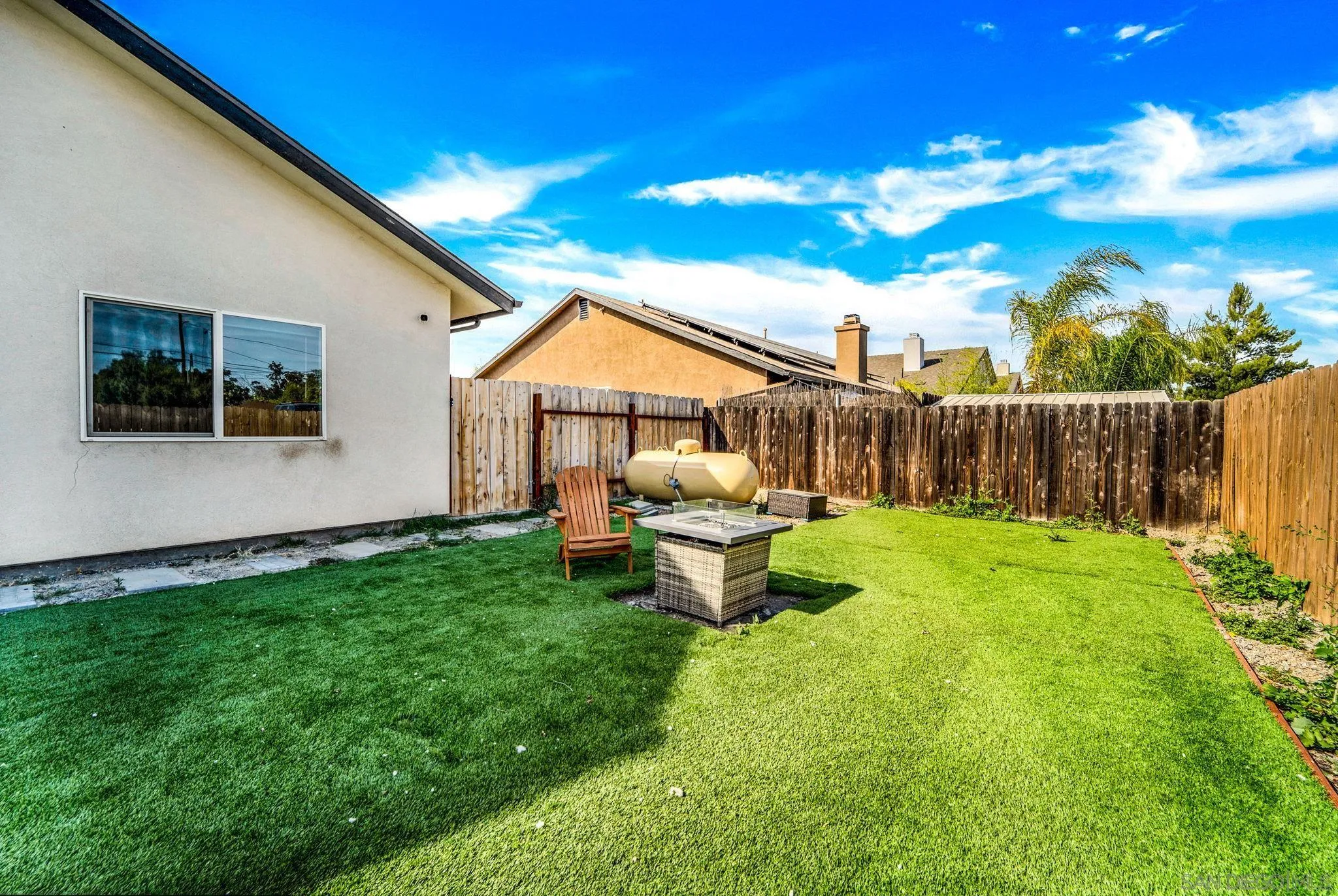 940 Passion Place Ramona, CA 92065 - Photo 22 of 25 a view of a house with backyard and a garden