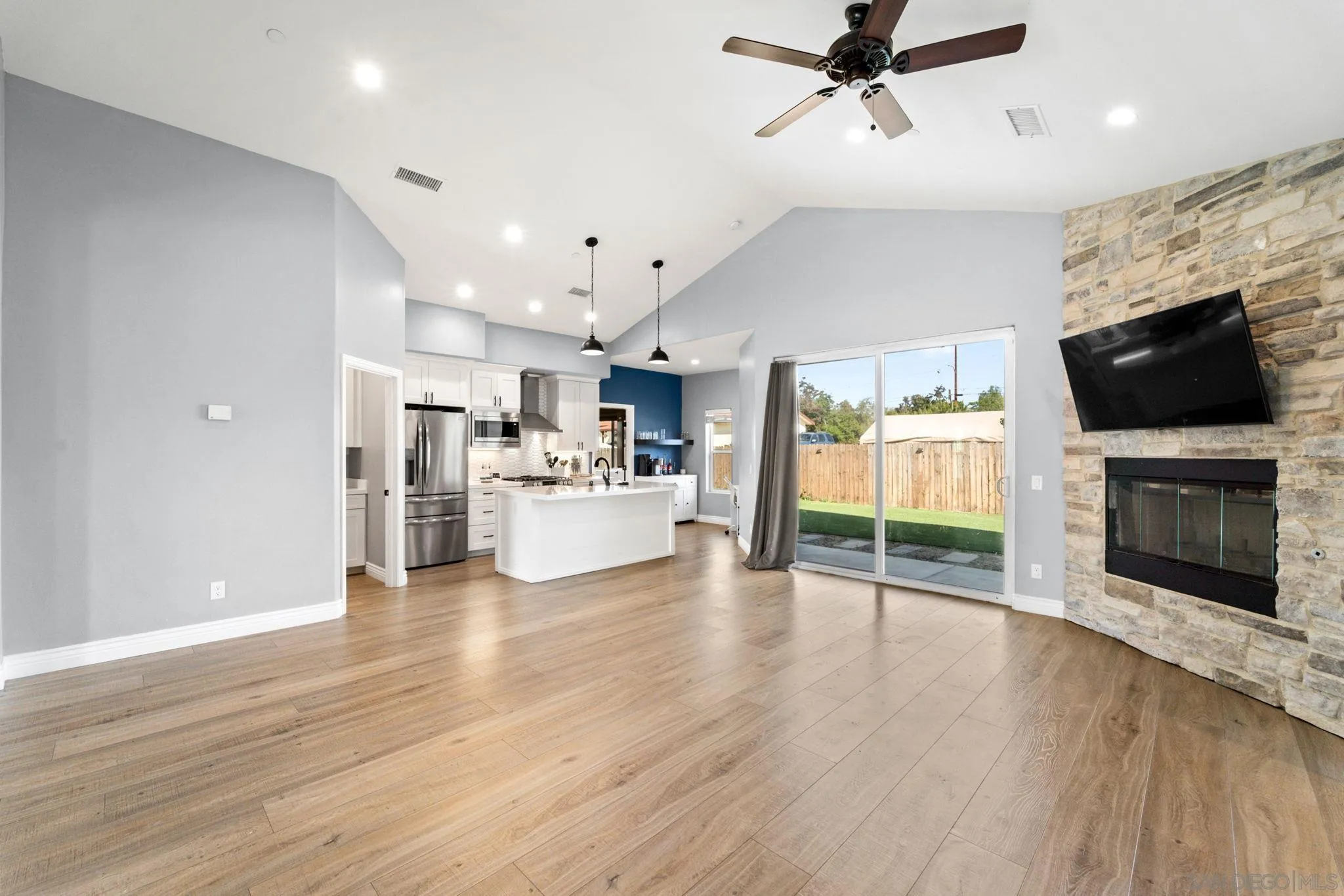 940 Passion Place Ramona, CA 92065 - Photo 6 of 25 a view of a livingroom with kitchen and fireplace