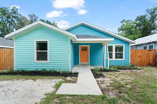 a front view of a house with yard