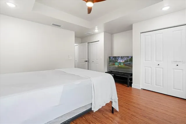 a bedroom with a bed and a dresser