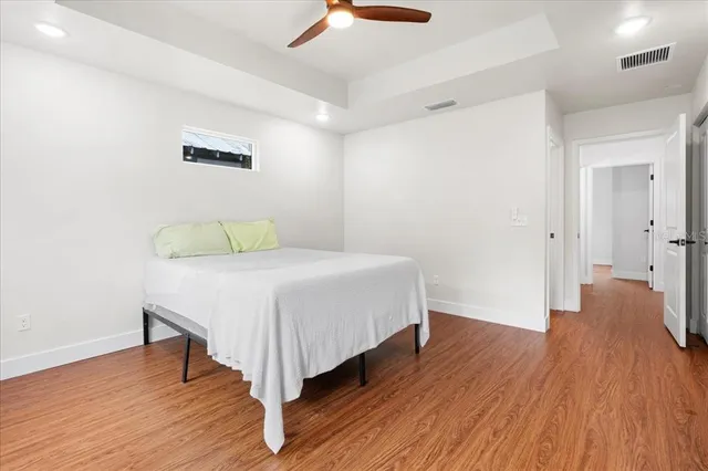 a bedroom with a bed and a table