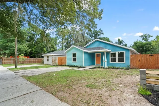 a house that has tree in front of it