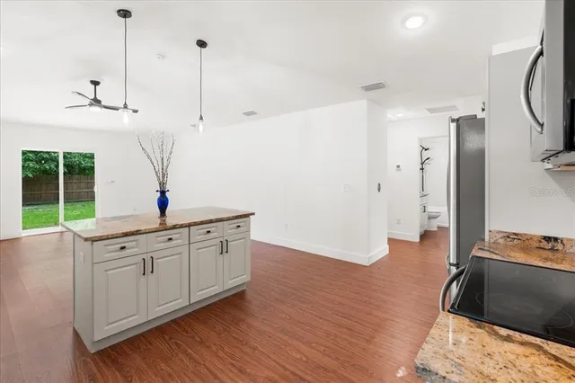 a spacious bathroom with a double vanity sink and a window