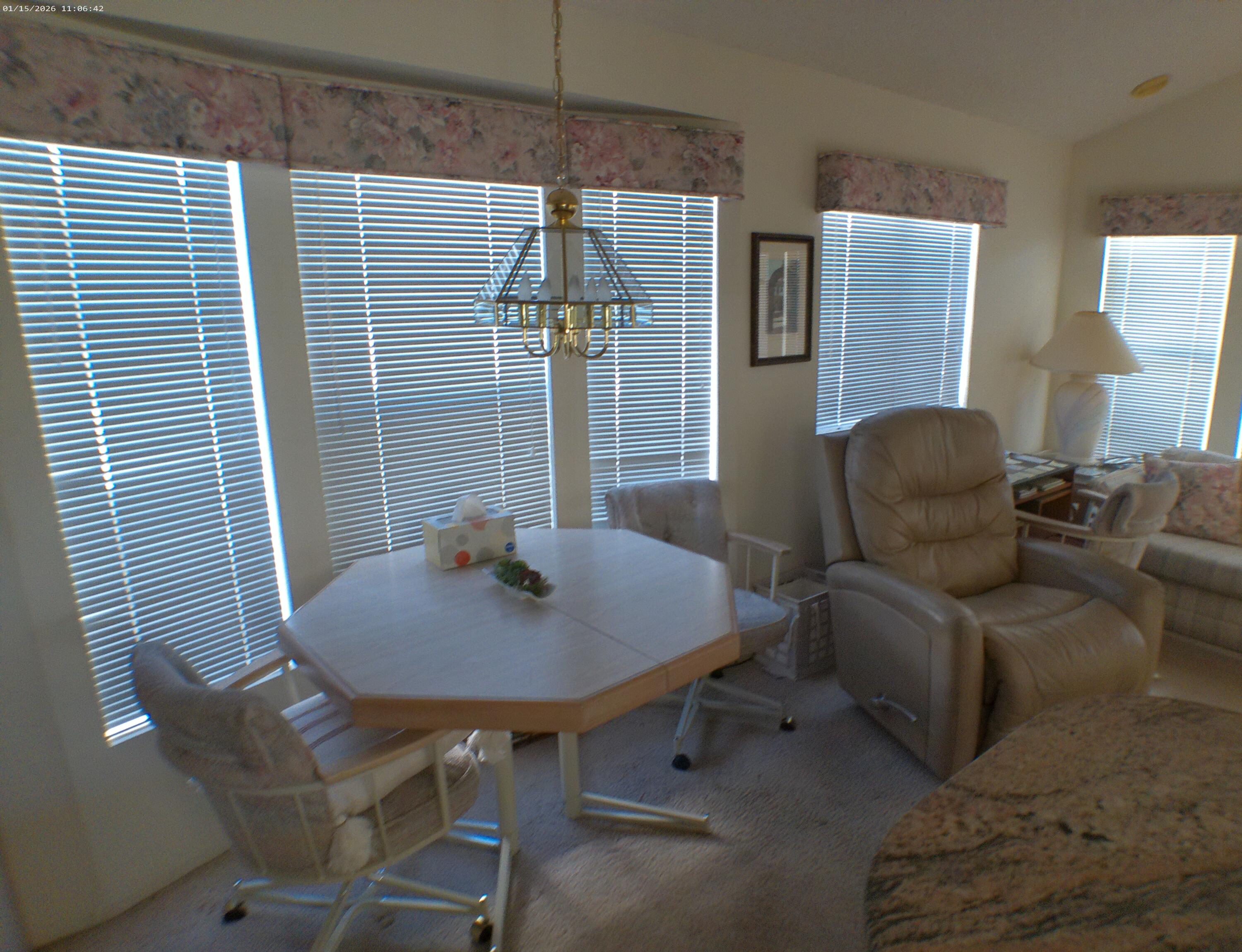 84136 Ave 44, Unit 337 Indio, CA 92203 - Photo 20 of 31 a living room with furniture and a potted plant