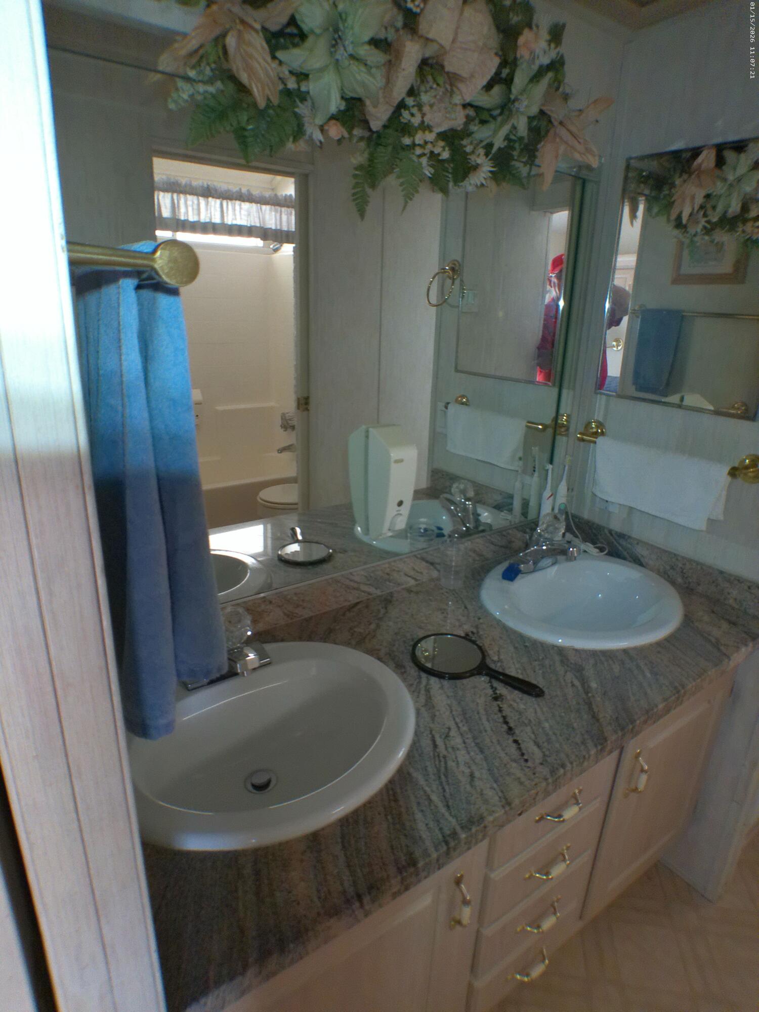 84136 Ave 44, Unit 337 Indio, CA 92203 - Photo 23 of 31 a bathroom with a sink and a mirror