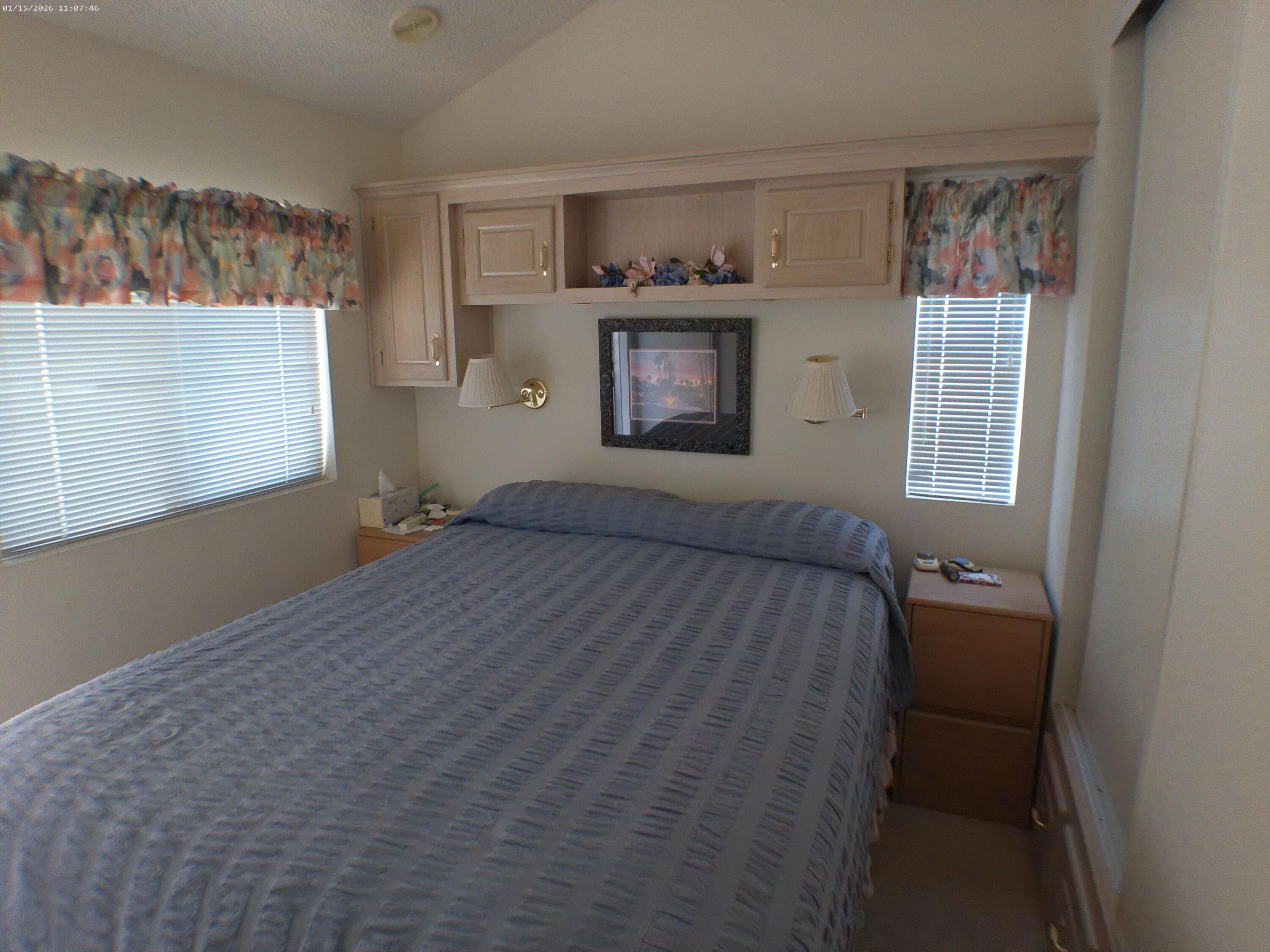 84136 Ave 44, Unit 337 Indio, CA 92203 - Photo 26 of 31 a bedroom with a bed and a window