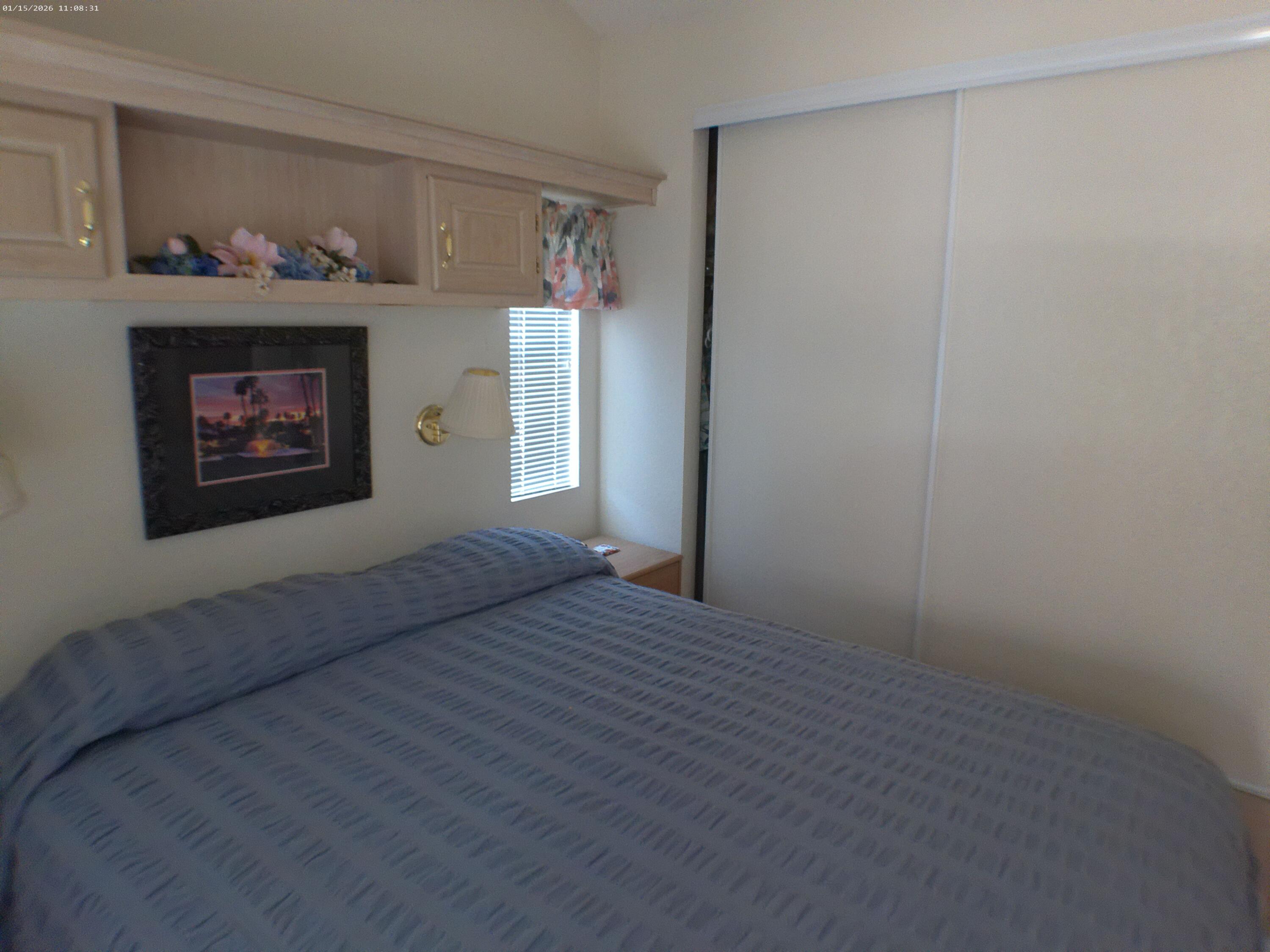 84136 Ave 44, Unit 337 Indio, CA 92203 - Photo 31 of 31 a bedroom with a bed and a window