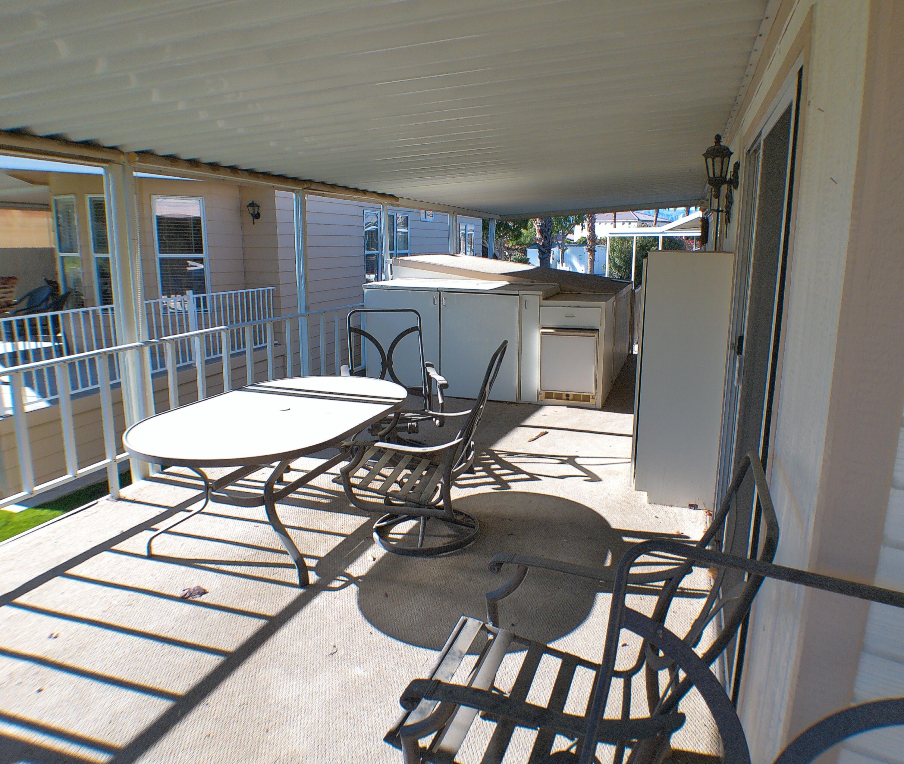 84136 Ave 44, Unit 337 Indio, CA 92203 - Photo 7 of 31 a view of a dining room with furniture and wooden floor