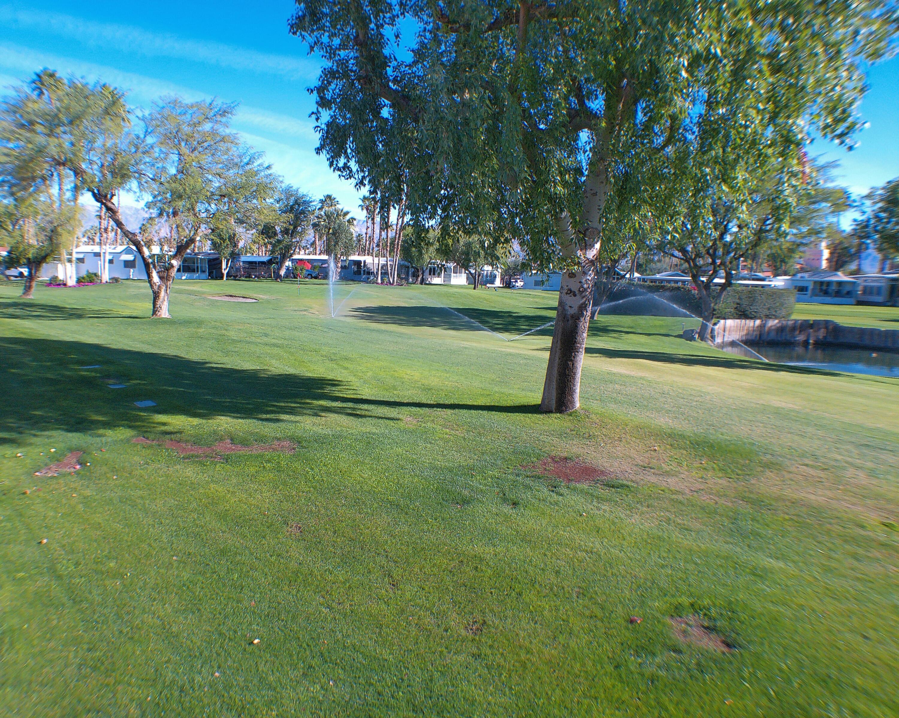 84136 Ave 44, Unit 337 Indio, CA 92203 - Photo 8 of 31 a view of a park with swings and slides
